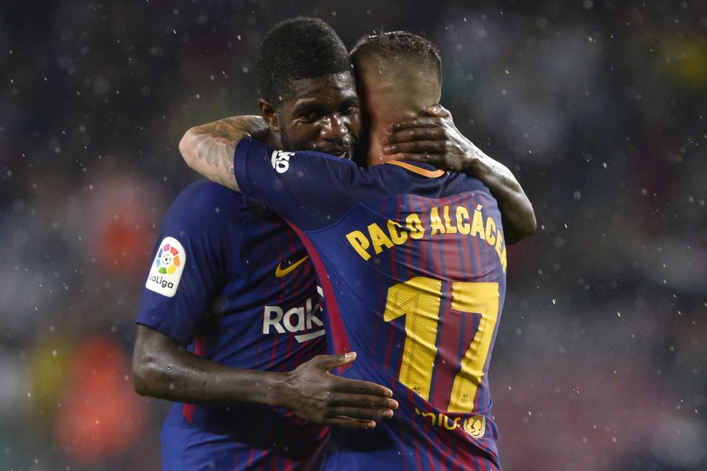 Samuel Umtiti i Paco Alcacer (Foto: AFP)