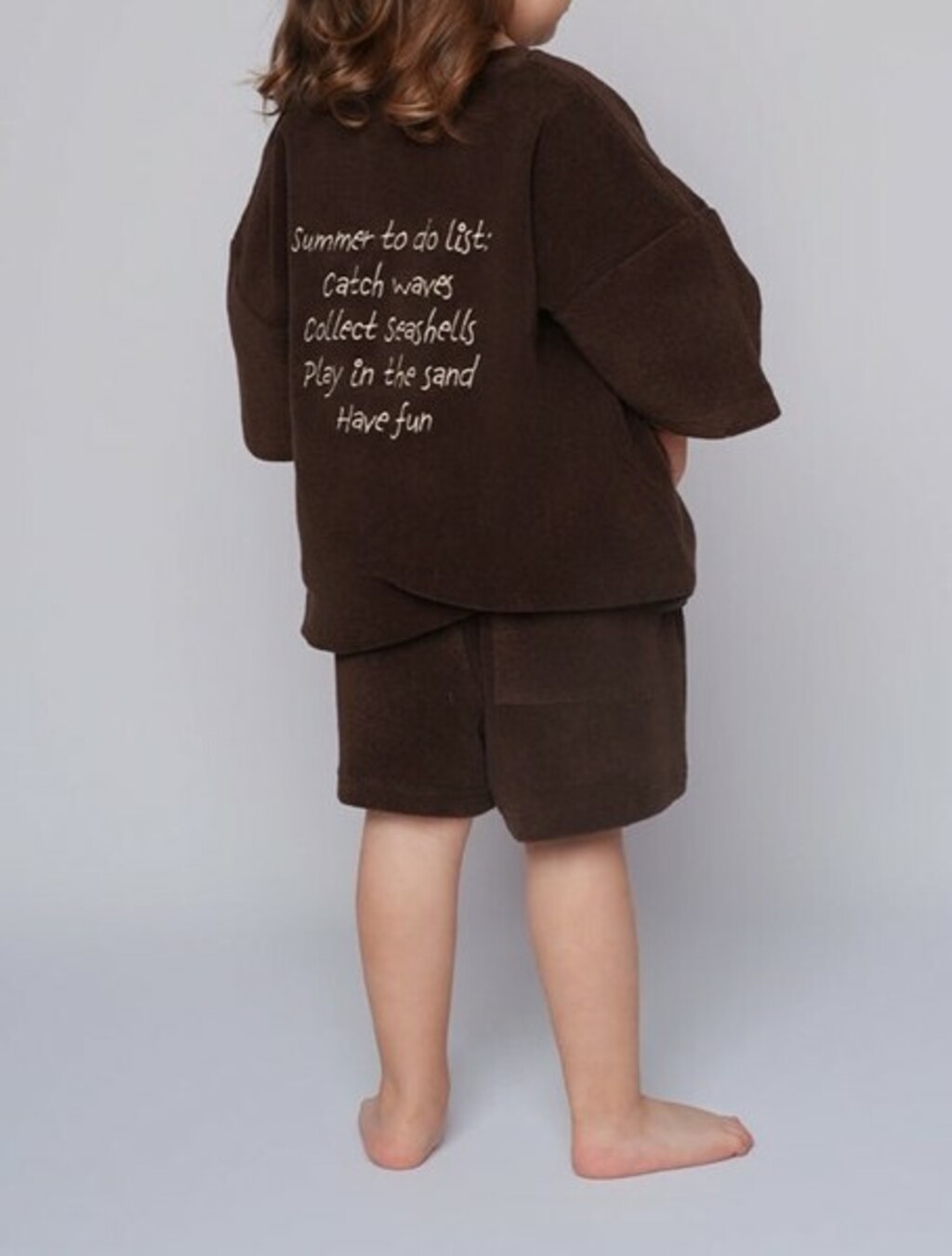 Komplet s porukom na leđima