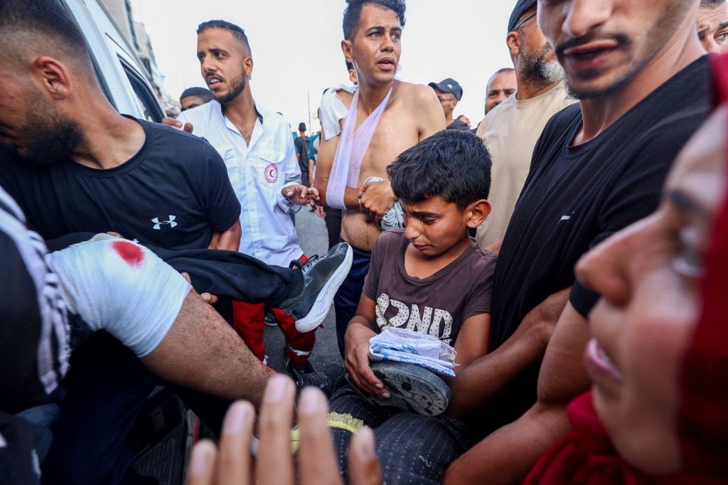 Palestinci u bijegu nakon pucnjave kod mjesta gdje se dijeli humanitarna pomoć - 2