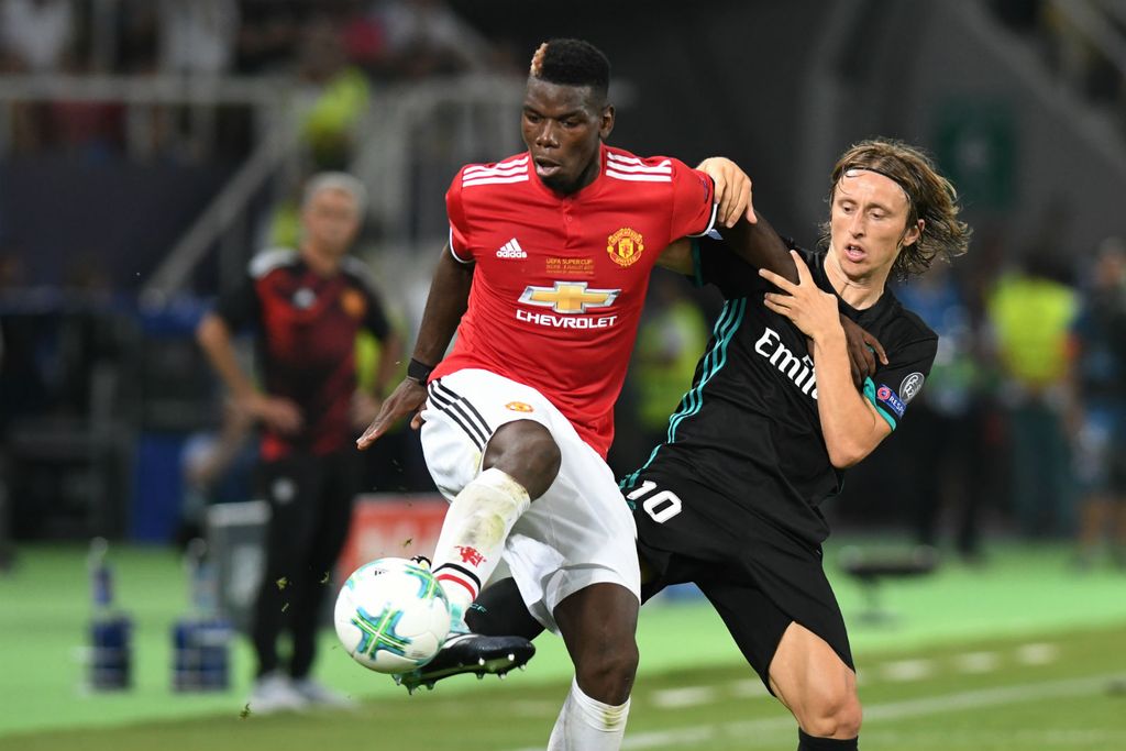 Paul Pogba i Luka Modrić (Foto: AFP)