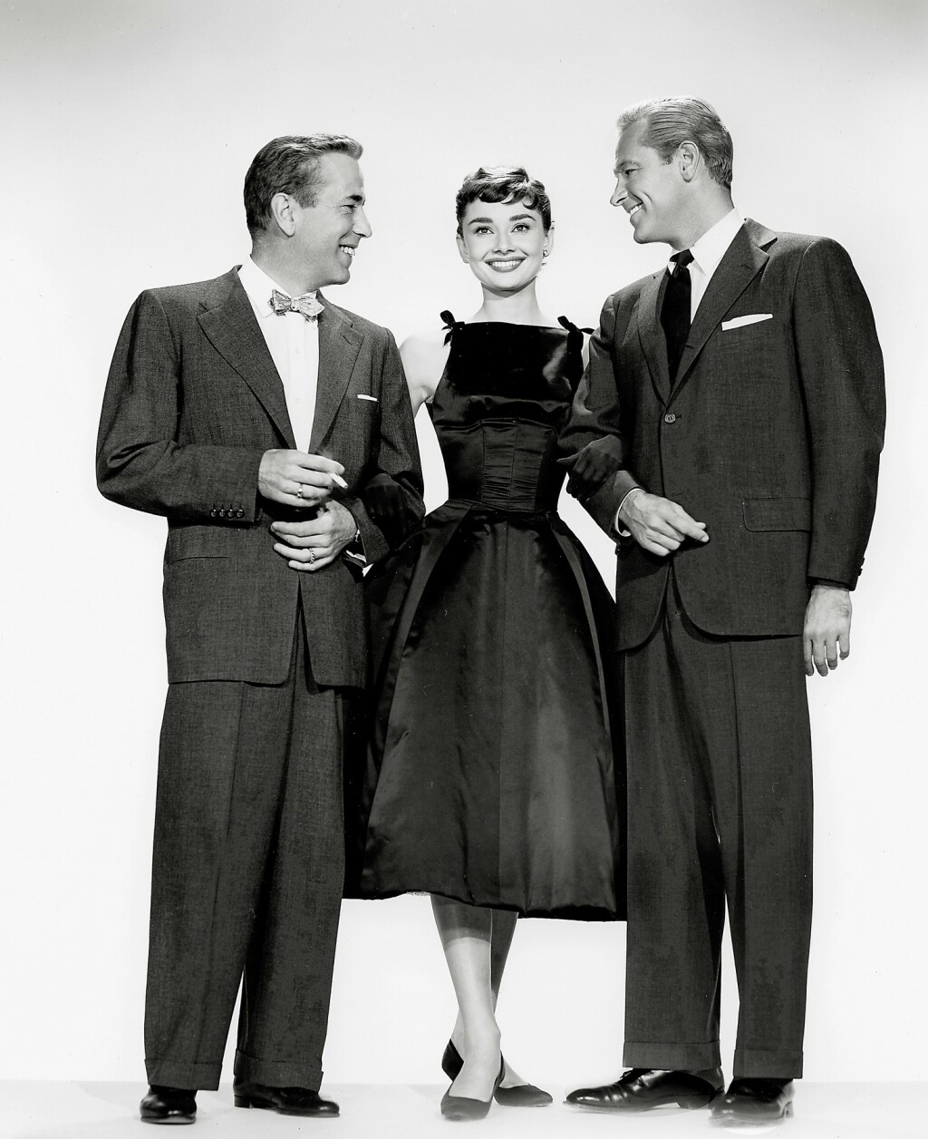 Audrey Hepburn (s Humphreyjem Bogartom i Williamom Holdenom) u kultnoj haljini iz filma Sabrina