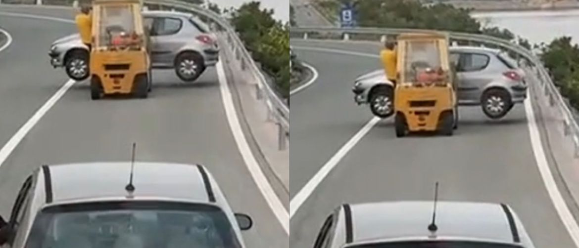 Viličar koji prijevozi automobil na cesti u Hrvatskoj