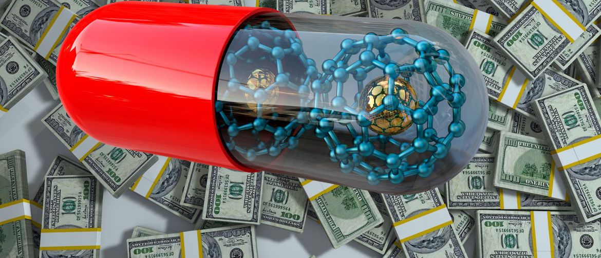 Čestice u piluli na pozadini od novaca