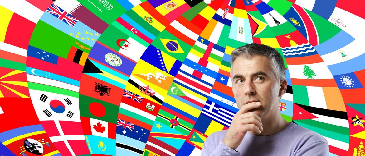 Muškarac koji razmišlja i zastave svijeta