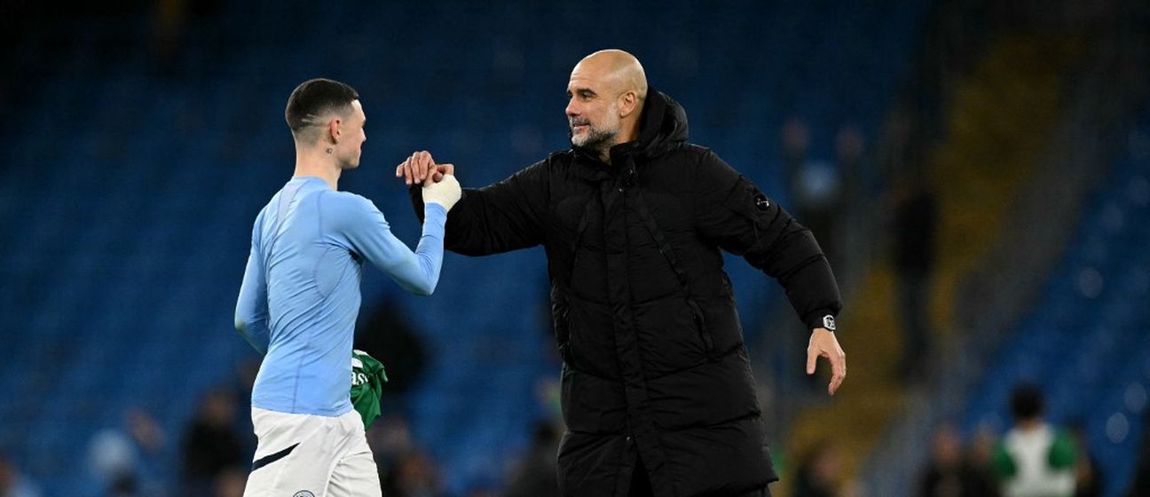 Phil Foden i Pep Guardiola