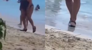 Žena na plaži u visokim petama