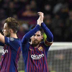 Ivan Rakitić i Lionel Messi (Foto: AFP)