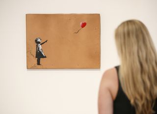 Slika Djevojčica s balonom (Foto: AFP)