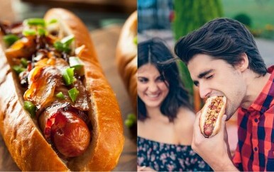 Hotdog na dasci i muškarac koji jede