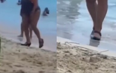 Žena na plaži u visokim petama