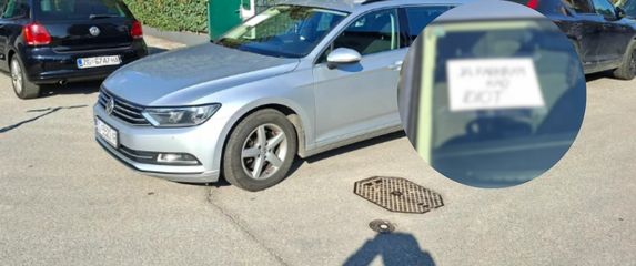 Nepropisno parkirano vozilo i natpis na staklu