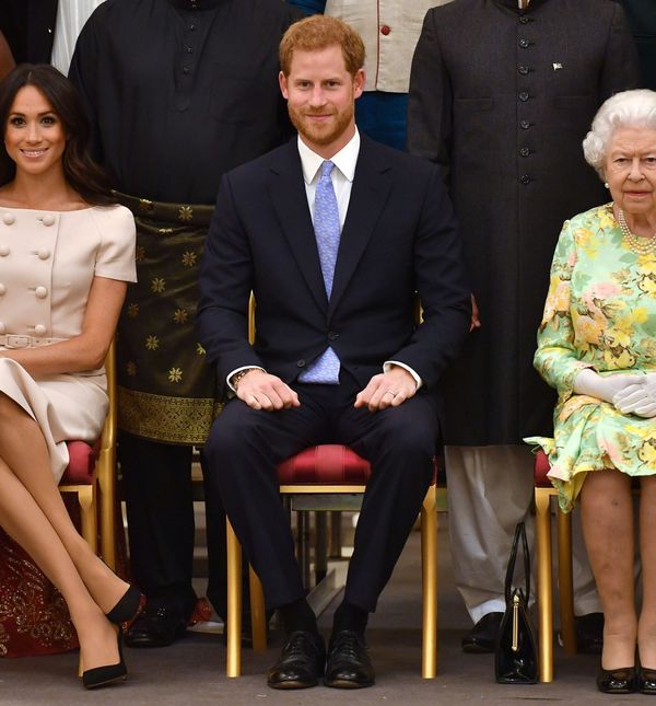 Fotografija Meghan Markle, princa Harryja i kraljice Elizabete II. iz 2018. godine