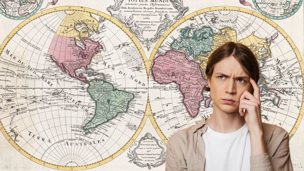 Muškarac koji razmišlja i stara karta svijeta