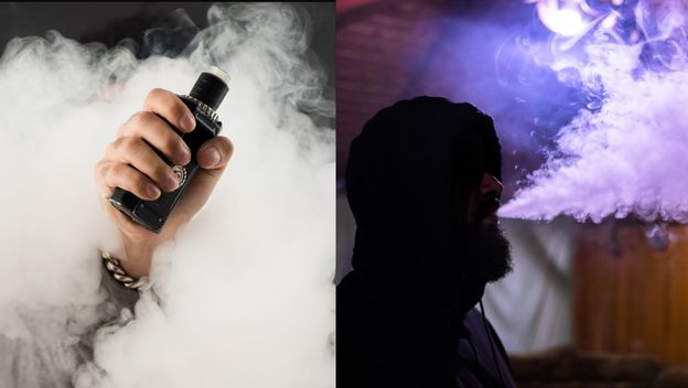 Elektronička cigareta u ruci u oblaku dima i muškarac koji ispuhuje dim