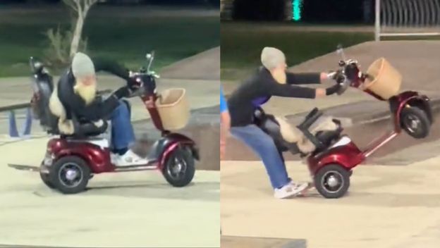 Čovjek s dugom sjedom bradom kako vozi skuter u skateparku