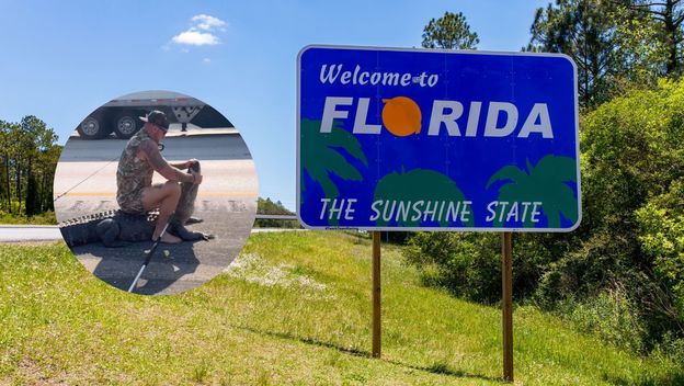 Oznaka uz cestu za ulazak u Floridu i muškarac koji se hrva s aligatorom