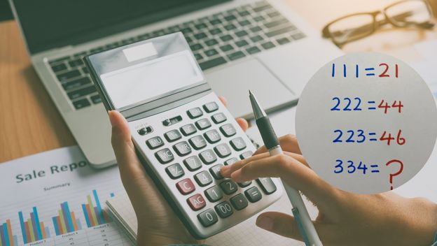 Osoba koja računa na kalkulator i matematička zagonetka