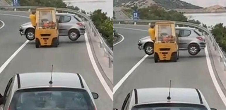Viličar koji prijevozi automobil na cesti u Hrvatskoj