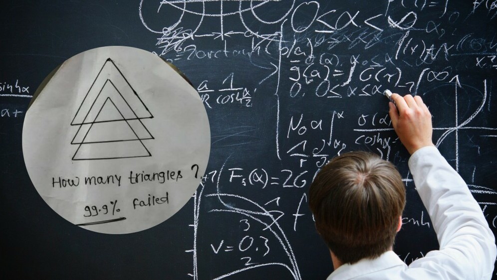 Matematičar koji piše po ploči i zagonetka s tri trokuta