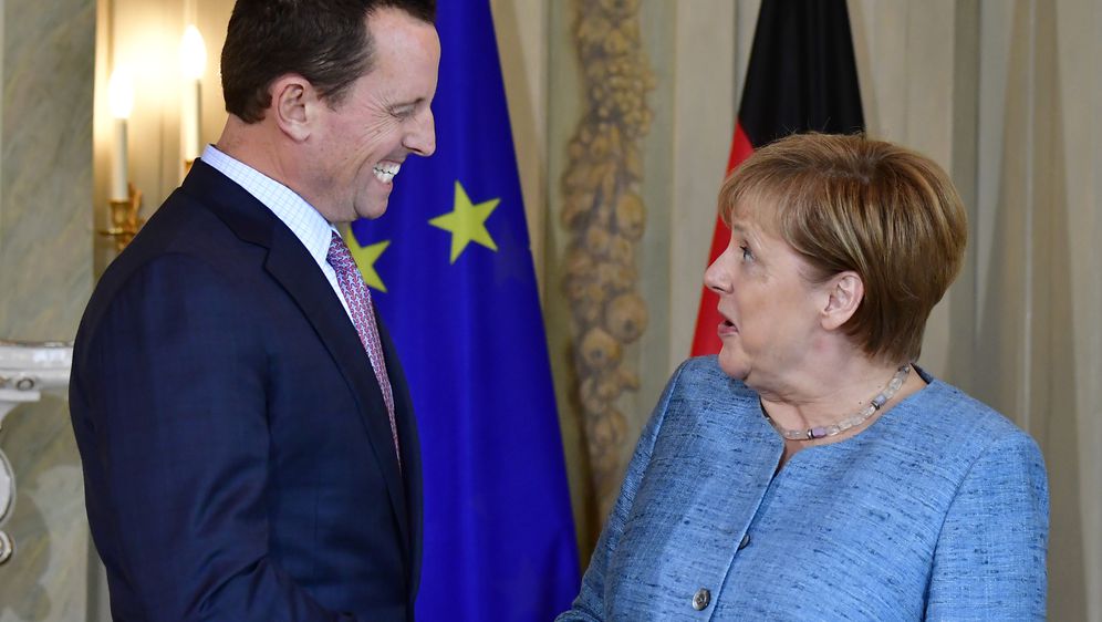 Richard Grenell i Angela Merkel (Foto: AFP)