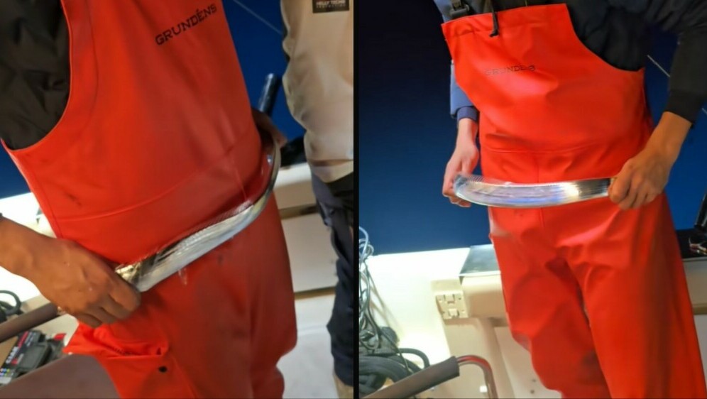 Neobična srebrena riba na brodu u rukama ribara