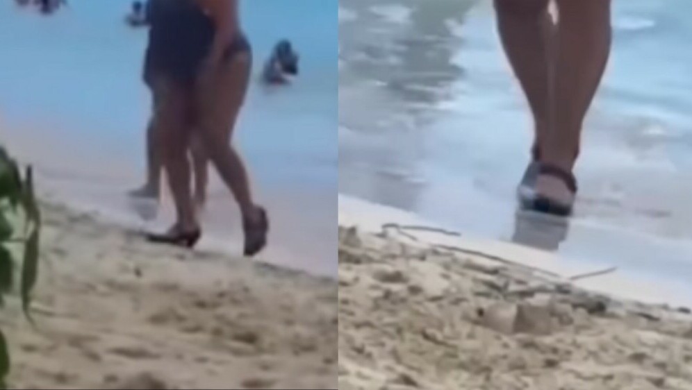 Žena na plaži u visokim petama
