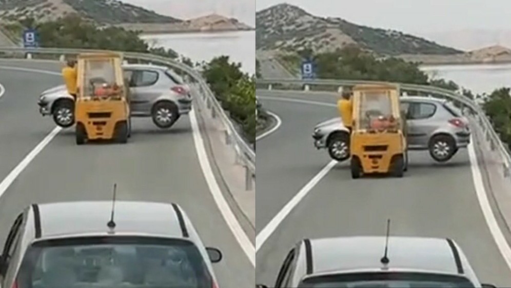 Viličar koji prijevozi automobil na cesti u Hrvatskoj