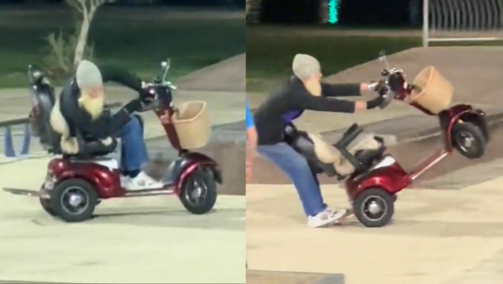 Čovjek s dugom sjedom bradom kako vozi skuter u skateparku