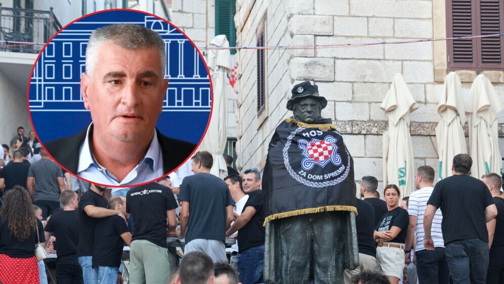 Miro Bulj i spomenik Tina Ujevića ogrnut u zastavu HOS-a