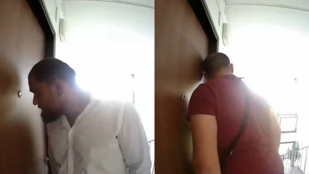 Snimka muškaraca ispred stana u Sigetu